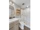 Updated bathroom showcasing a modern vanity and a walk-in shower with glass doors at 835 S Shoshone St, Denver, CO 80223