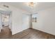 Cozy bedroom featuring hardwood floors, natural light and adjacent bathroom at 835 S Shoshone St, Denver, CO 80223