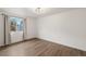 Bright bedroom with hardwood floors and large windows, perfect for relaxation and rest at 835 S Shoshone St, Denver, CO 80223