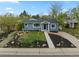 Charming home featuring a well-manicured front yard and inviting curb appeal at 835 S Shoshone St, Denver, CO 80223