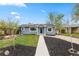 Charming single-story home featuring a landscaped front yard and a welcoming entrance at 835 S Shoshone St, Denver, CO 80223