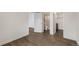 Open living area with hardwood floors that leads to a modern bathroom at 835 S Shoshone St, Denver, CO 80223