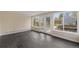 Sunroom with tile floors, multiple windows, and outdoor access to backyard at 835 S Shoshone St, Denver, CO 80223