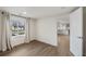 Bright living room featuring wood floors, neutral paint, and an open floor plan at 835 S Shoshone St, Denver, CO 80223