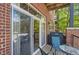 Enjoy the open-air balcony with grill, comfortable seating, and sliding door entrance at 5401 S Park Terrace Ave # 109A, Greenwood Village, CO 80111