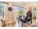 Inviting dining room with a sliding door to a balcony, a modern table set, and sheer curtains filtering natural light at 5401 S Park Terrace Ave # 109A, Greenwood Village, CO 80111