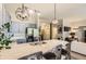 Modern kitchen with stainless steel appliances, granite countertops, and stylish lighting at 5401 S Park Terrace Ave # 109A, Greenwood Village, CO 80111