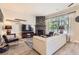 Cozy living room with a stone fireplace, a large window with natural light, and modern furnishings and decor at 5401 S Park Terrace Ave # 109A, Greenwood Village, CO 80111