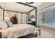 Serene main bedroom with a four-poster bed, comfortable furnishings, and modern decor at 5401 S Park Terrace Ave # 109A, Greenwood Village, CO 80111