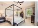 Relaxing main bedroom with a four-poster bed, natural light, and ample closet space at 5401 S Park Terrace Ave # 109A, Greenwood Village, CO 80111