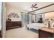 Spacious main bedroom with a four-poster bed, dresser, and a comfortable atmosphere at 5401 S Park Terrace Ave # 109A, Greenwood Village, CO 80111