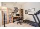 Bright office space features a desk, shelving and treadmill, perfect for working from home and staying active at 5401 S Park Terrace Ave # 109A, Greenwood Village, CO 80111
