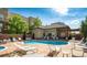 Sparkling community pool surrounded by lounge chairs, ideal for relaxation and leisure at 5401 S Park Terrace Ave # 109A, Greenwood Village, CO 80111