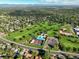 Aerial view of neighborhood featuring a lush golf course, pool, tennis courts and community center at 6726 S Franklin St, Centennial, CO 80122