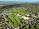 Expansive aerial view of neighborhood with golf course, tennis courts and community center at 6726 S Franklin St, Centennial, CO 80122
