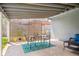 Covered back patio area with dining set and outdoor grill at 6726 S Franklin St, Centennial, CO 80122