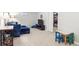Open basement area featuring a large seating area, entertainment center and small table/chair set at 6726 S Franklin St, Centennial, CO 80122