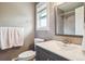 Updated bathroom with a gray vanity, modern fixtures, and tiled shower, offering a clean and functional design at 6726 S Franklin St, Centennial, CO 80122