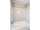 Tiled shower and tub with shower head provide a fresh, clean bathing experience at 6726 S Franklin St, Centennial, CO 80122