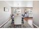 Inviting dining room area features updated lighting and stainless steel appliances nearby at 6726 S Franklin St, Centennial, CO 80122