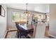 Bright dining room features a chandelier and view to the kitchen at 6726 S Franklin St, Centennial, CO 80122