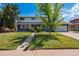 Charming two-story home with a well-manicured lawn and inviting front porch at 6726 S Franklin St, Centennial, CO 80122