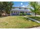 Charming two-story home featuring a lush green lawn and a welcoming front porch at 6726 S Franklin St, Centennial, CO 80122