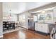 Eat-in kitchen with stainless steel refrigerator, and hardwood floors at 6726 S Franklin St, Centennial, CO 80122