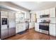 Modern kitchen with stainless steel appliances and white cabinets, lots of natural light at 6726 S Franklin St, Centennial, CO 80122