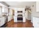Bright kitchen featuring stainless steel appliances, white cabinets and subway tile backsplash at 6726 S Franklin St, Centennial, CO 80122