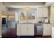 Kitchen features a stainless steel fridge and lots of natural light at 6726 S Franklin St, Centennial, CO 80122