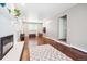 Spacious living room with hardwood floors, fireplace, and lots of natural light at 6726 S Franklin St, Centennial, CO 80122