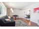 Cozy living room featuring hardwood floors, ample natural light, and dining area at 6726 S Franklin St, Centennial, CO 80122