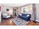 Cozy living room featuring hardwood floors, ample natural light, and neutral paint at 6726 S Franklin St, Centennial, CO 80122