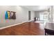 Large living room features wood floors, white trim and access to the backyard at 6726 S Franklin St, Centennial, CO 80122
