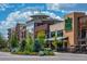 Whole Foods Market in a busy shopping center with restaurants and boutiques surrounded by trees at 6726 S Franklin St, Centennial, CO 80122