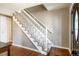 Inviting foyer staircase features wood flooring and white railing at 6726 S Franklin St, Centennial, CO 80122