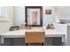 Brightly lit vanity with a large mirror, and light green walls at 6726 S Franklin St, Centennial, CO 80122