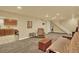 Finished basement with neutral walls and carpet, recessed lighting, kitchenette and basement stairs at 7631 Oak St, Arvada, CO 80005