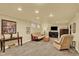 Finished basement with neutral walls and carpet, recessed lighting, and comfortable seating area at 7631 Oak St, Arvada, CO 80005