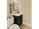 Bathroom with modern vanity and fixtures at 7631 Oak St, Arvada, CO 80005