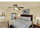Bedroom features a serene atmosphere, complemented by a large mirror and stylish furnishings at 7631 Oak St, Arvada, CO 80005