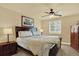 Comfortable bedroom with a ceiling fan, window and furnishings at 7631 Oak St, Arvada, CO 80005