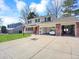 Spacious home featuring large driveway and garage with ample parking space at 7631 Oak St, Arvada, CO 80005