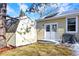 Exterior view of a well-maintained shed, providing ample storage space, next to house and utility boxes at 7631 Oak St, Arvada, CO 80005