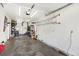 Spacious garage with ample storage space, perfect for parking and home projects with wall-mounted shelving at 7631 Oak St, Arvada, CO 80005