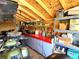 Well-organized garage with an ATV, workbench, red countertop, and ample shelving for storage and tools at 7631 Oak St, Arvada, CO 80005