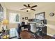 Efficient home office space features natural light, multiple monitors, and hardwood floors at 7631 Oak St, Arvada, CO 80005