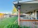 Enjoy this backyard with a covered patio, wooden fence, shed and lovely lawn at 2118 S Mobile Way, Aurora, CO 80013