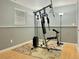 Basement features a workout space with padded floors and a weight machine at 2118 S Mobile Way, Aurora, CO 80013